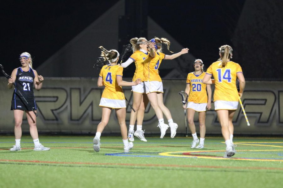 Senior+Kaelin+Hogan+%28left%29+and+sophomore+Shayne+Rivard+%28right%29+celebrate+after+Rivard+scores+a+goal+in+the+second+half+of+the+game.