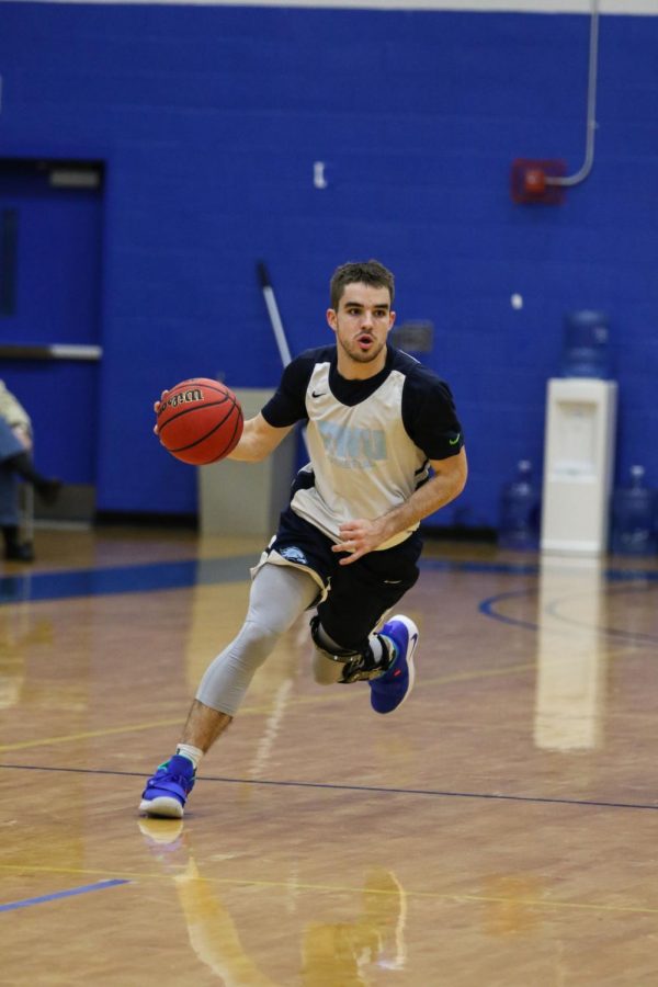 Sophomore Bryan Donovan brings the ball up the court in their scrimmage Sunday, Nov. 4.