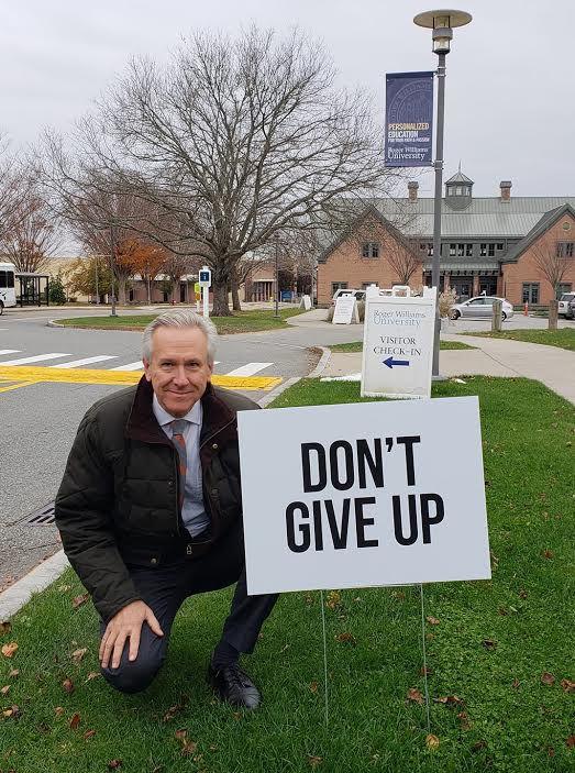 RWU’s Director of Public Safety, Steve Melaragno, is pictured with one of the “Don’t Give Up” signs on campus, which is part of Bristol Kindness Project.