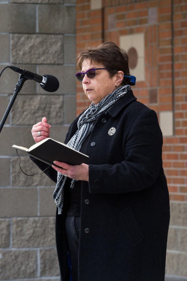 Reverend Nancy Soukup offers a prayer at an event in 2018, requesting a moment of silence for those lost to gun violence. 