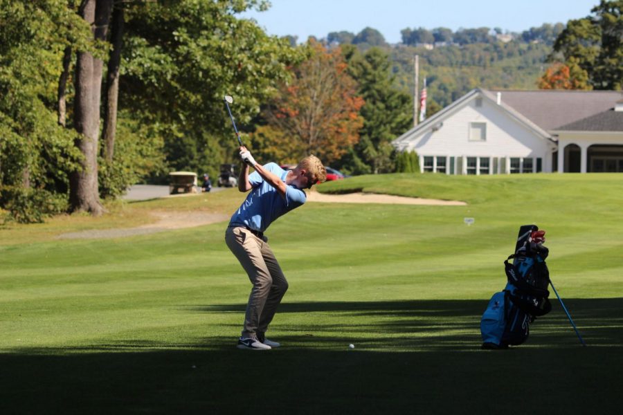Senior Cullen Zurcher winding up to hit the ball at their  tournament in Wilbraham Mass. on Sept. 19. The team placed third in the tournament and qualified for the Commonwealth Coast Conference Championships.     