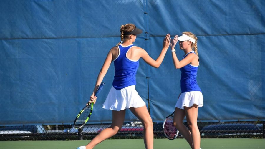 Emma Place and Libby Bennett celebrate during a match.  