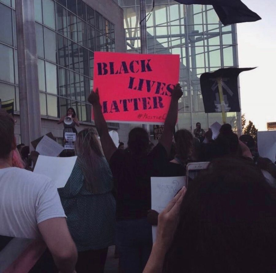 A person holds up a sign at a Black Lives Matter rally in Providence, R.I. 2016