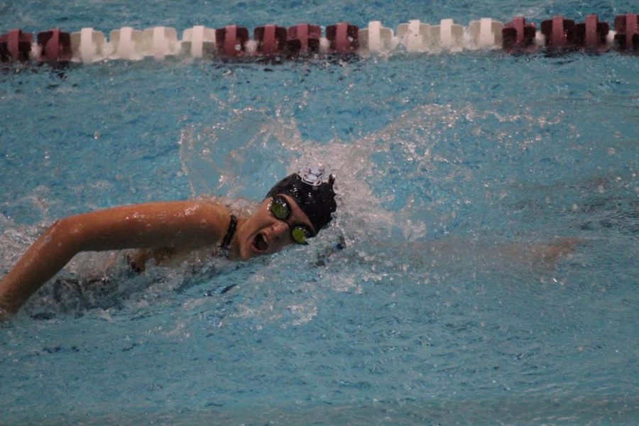 Slusarcyzk competes in the sprint event at a swim meet. 