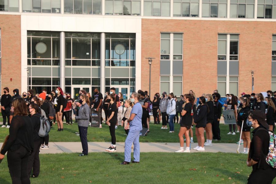 Protestors marched together from the Field House to the front of the library and demanded change from the university's administrators and faculty. 