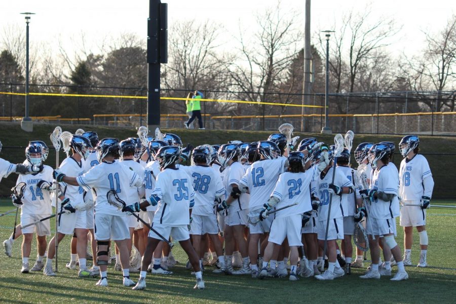 The mens lacrosse team comes together for a huddle after a victory against Eastern Connecticut State University on Tuesday, March 23. The team returned to competition on Saturday, April 3, holding a record of 4-2 so far this season.