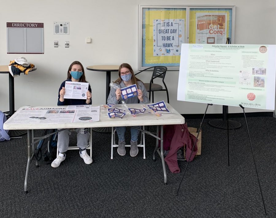 Shannon DeFranza (left) and Hannah Sterling (right) participate in Table Times in the Rec Center on April 15 to spread awareness about imprisoned scholars.
