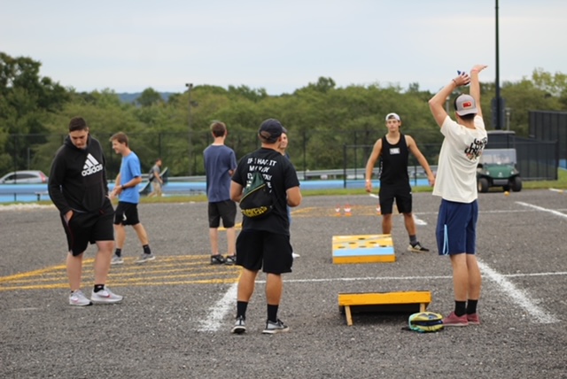 Students playing bean bag toss during the Fall Concert on Sept. 5, 2021.