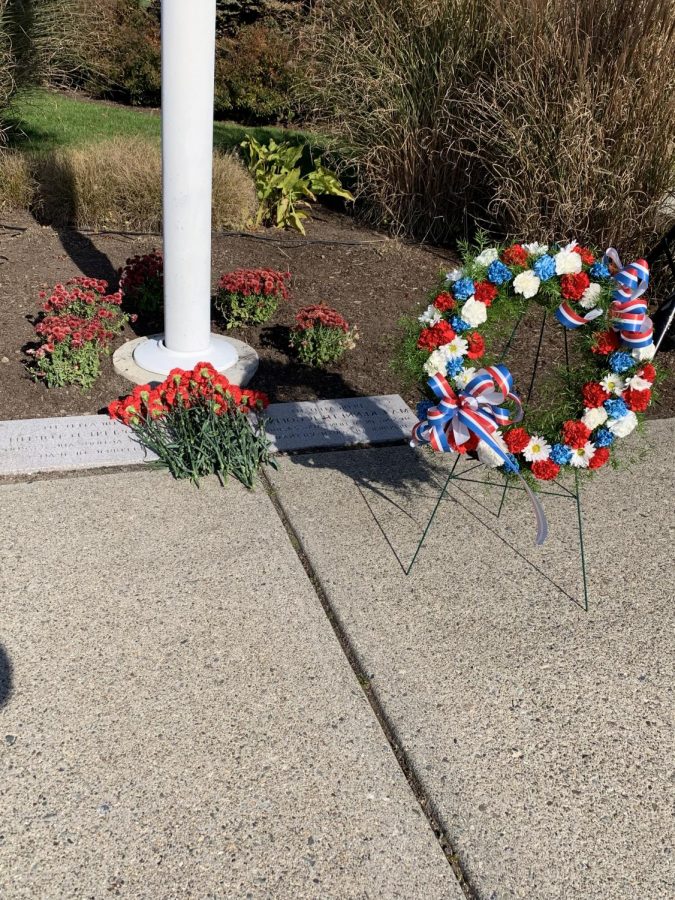 A+memorial+wreath+and+carnations+of+remembrance+in+honor+of+fallen+RWU+veterans+Maj.+Kenneth+B.+Goff+and+Lt.+Joesph+D.+Fortin.