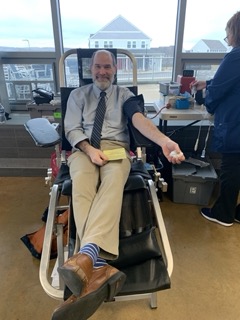 Charlie Thomas, part of the school of engineering faculty, as he is giving blood at the blood drive.