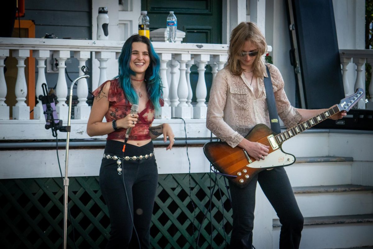 Singer Alerisa Rose and lead guitarist Chase Cavacco play at Brisol’s Porchfest.