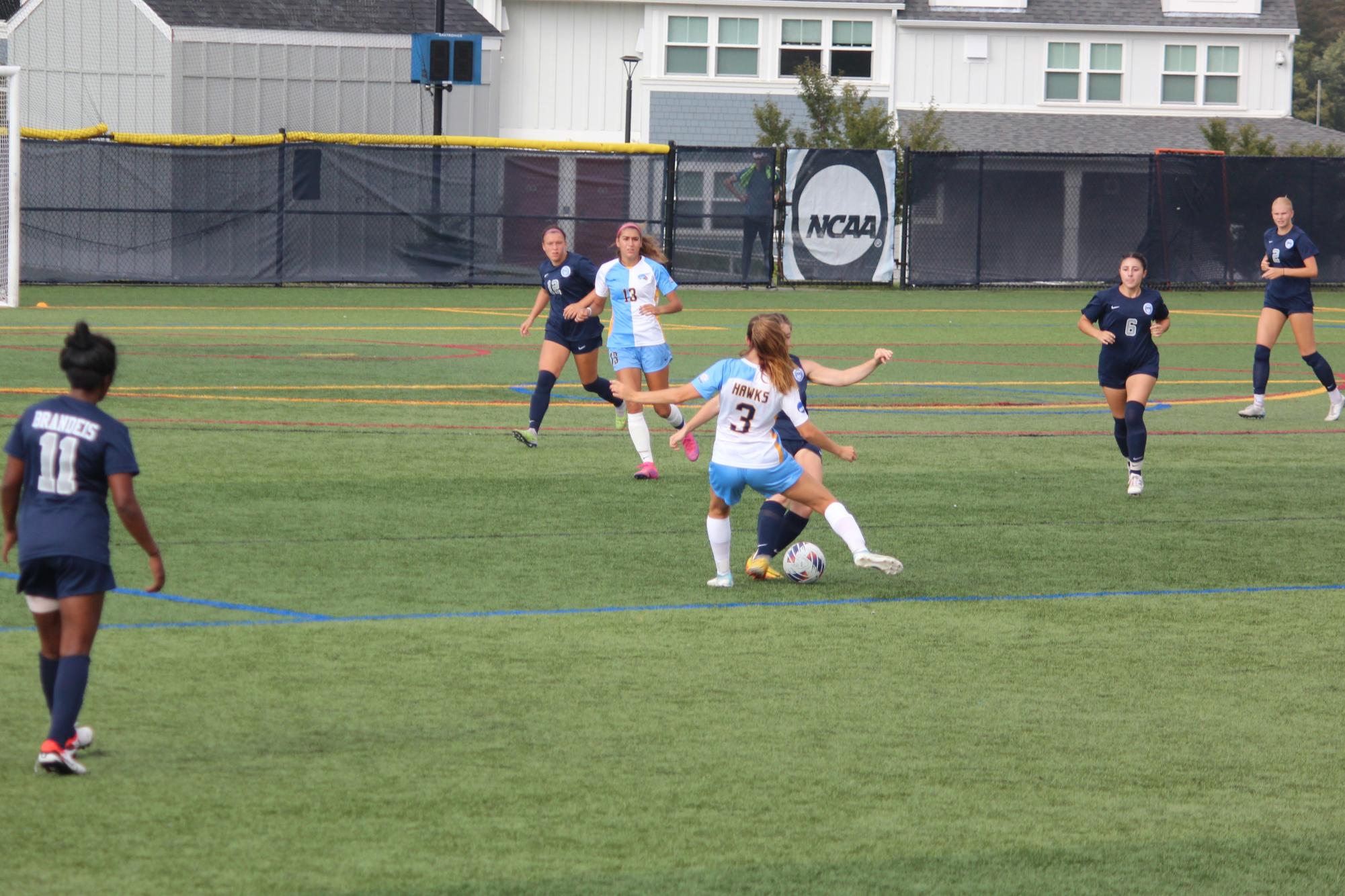 Midfielder, Sophomore Sarah Newman, challenges a Brandeis University player for the ball. RWU Women’s Soccer team’s current record is 1-4-2.