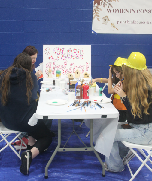 Students painting and getting creative at homecoming weekend.