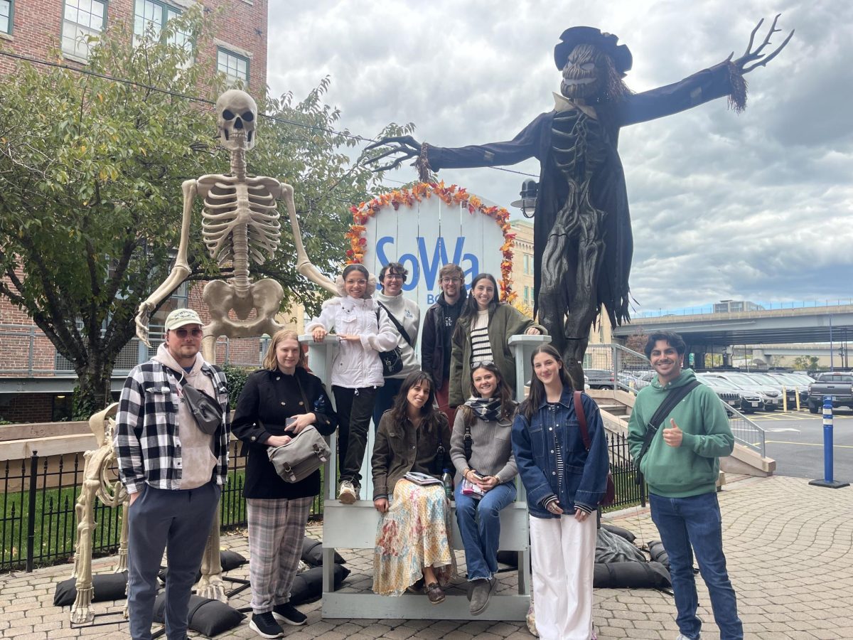 RWU Visual Arts Students pose with Halloween decorations near galleries and studio spaces in the SoWa area of Boston, MA.

