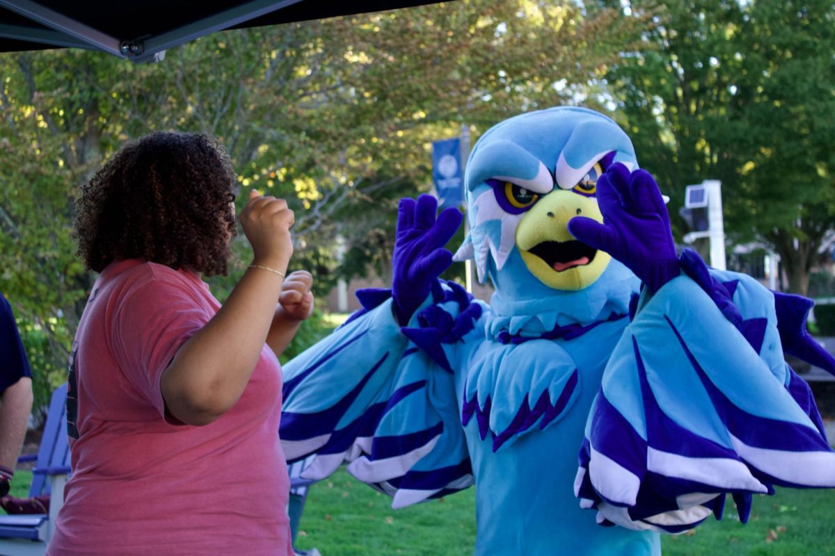 Swoop and CEN's secretary Olivia Sorrell enjoy dancing at CEN and MSU's Thursday Night Throwdown event 9/18.