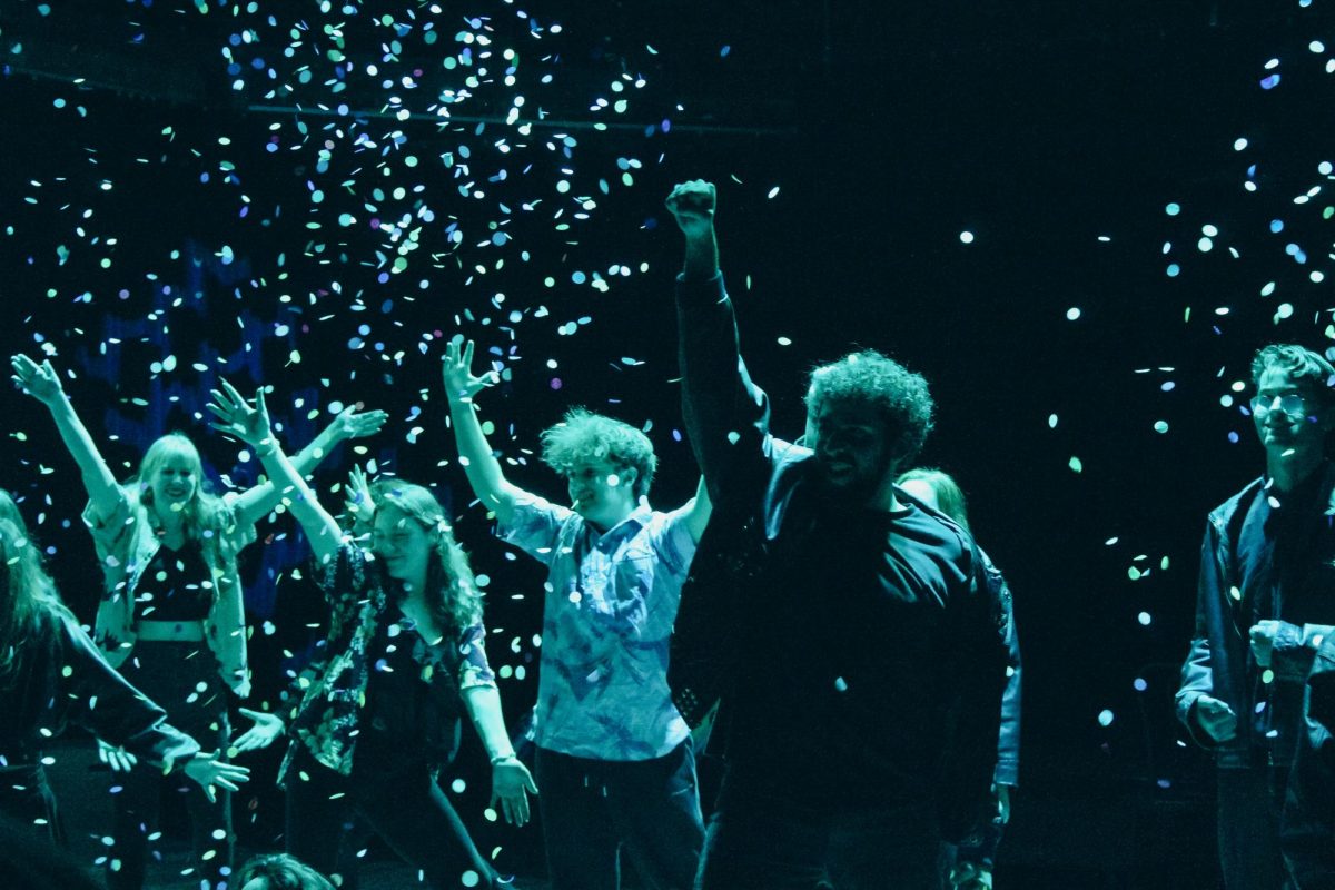 Confetti falls at the end of the cast's performance of "Cruisin' for a Bruisin'" from Teen Beach Movie