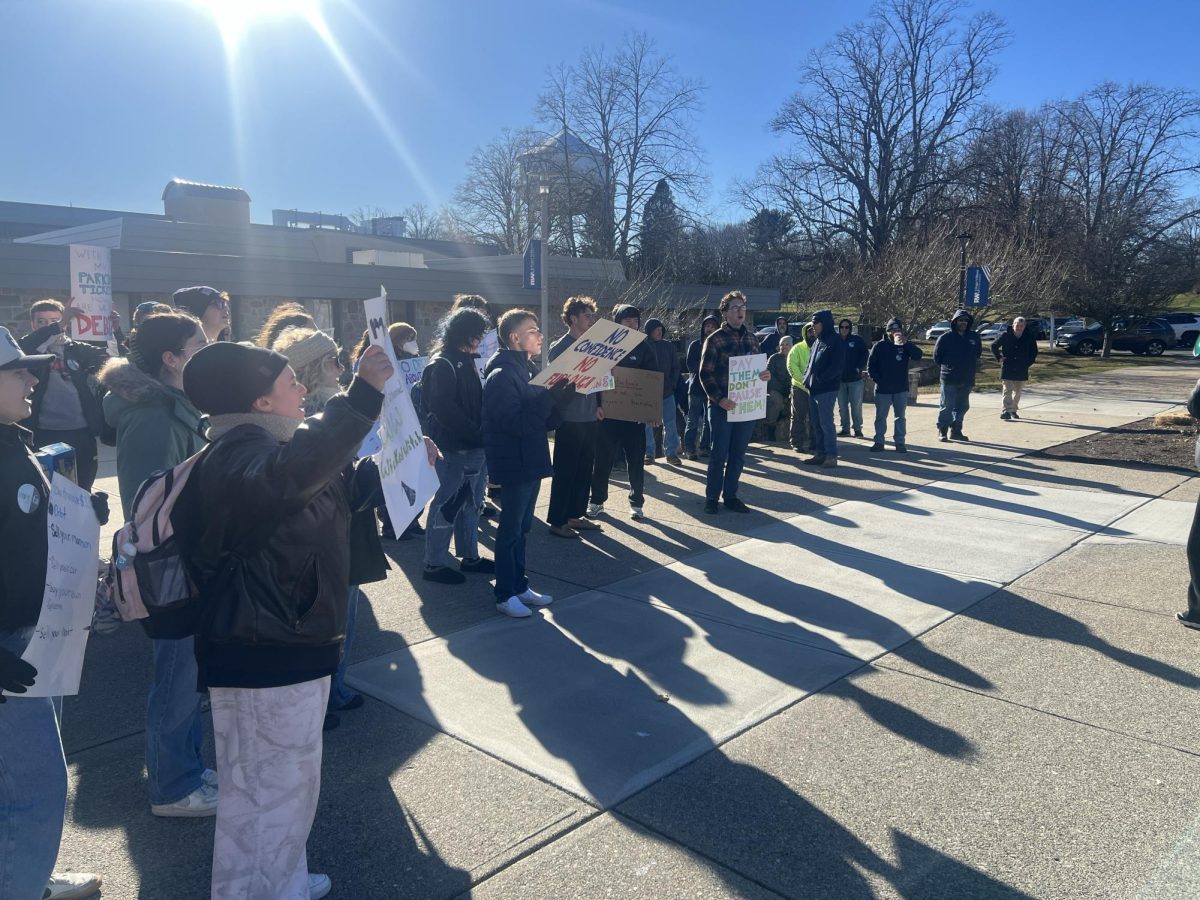 A crowd of student protestors gather to demonstrate outside the Administration building.