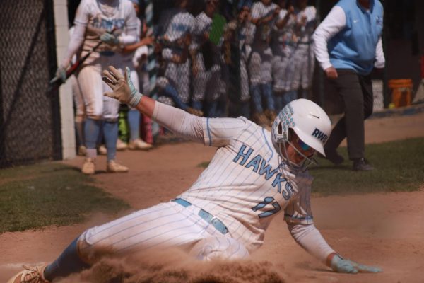 Junior Short Stop Shannon Starratt slides on base 